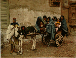 Arab women riding a donkey cart